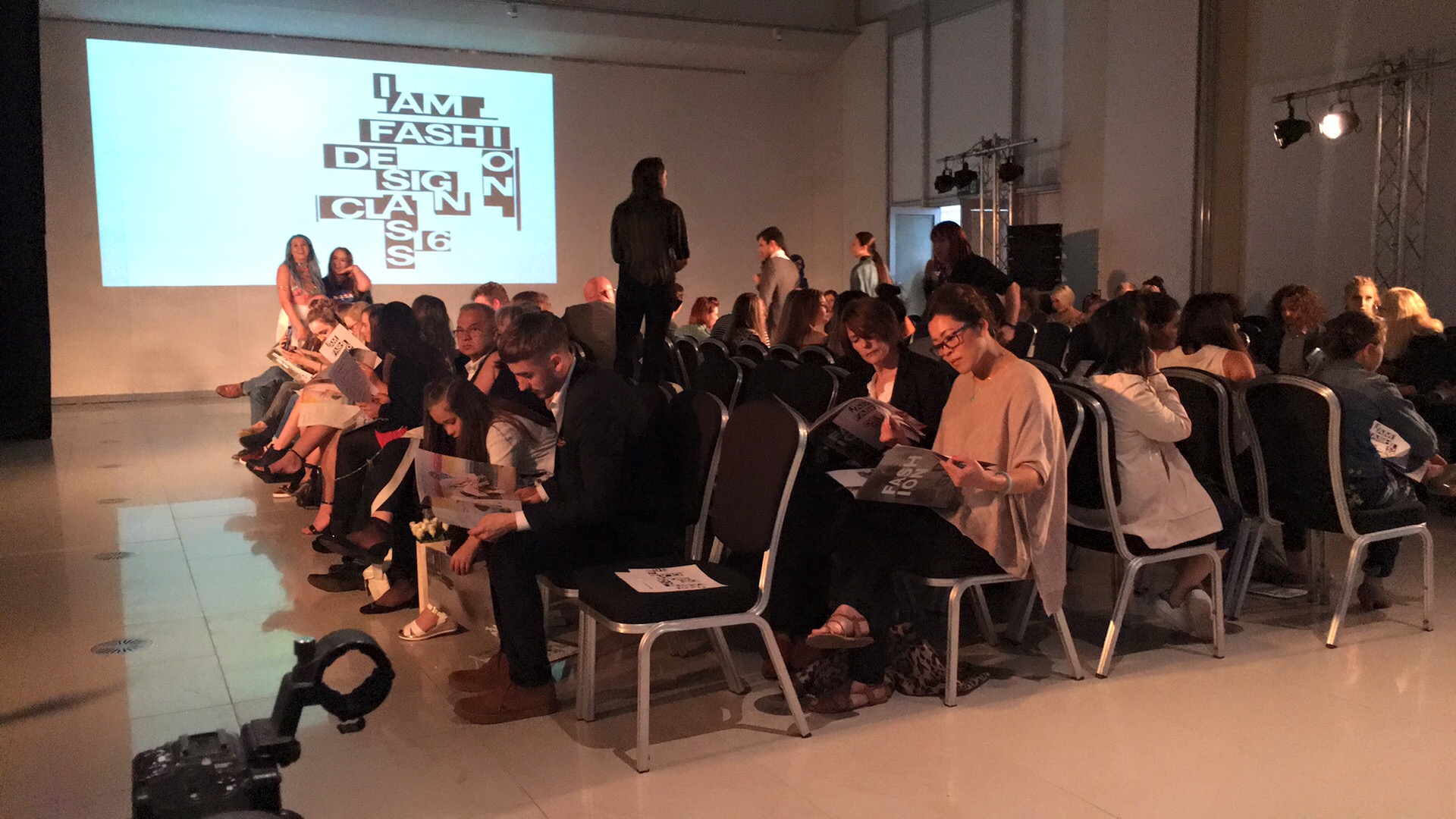 Guests seated beside the runway at the Sheffield Hallam Graduate Fashion Show.