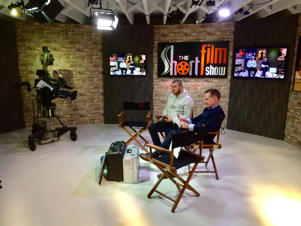 Studio cameras and presenters on the set of The Short Film Show.