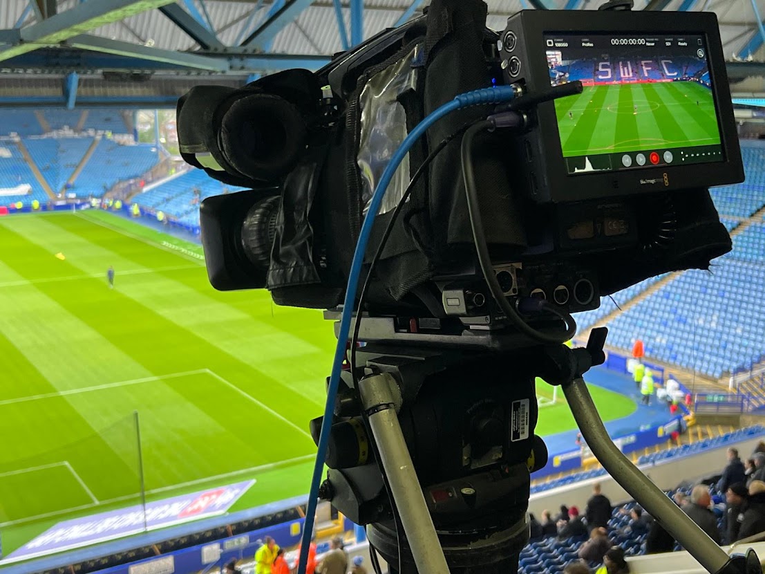 Broadcast camera overlooking the football pitch and stands at Hillsborough