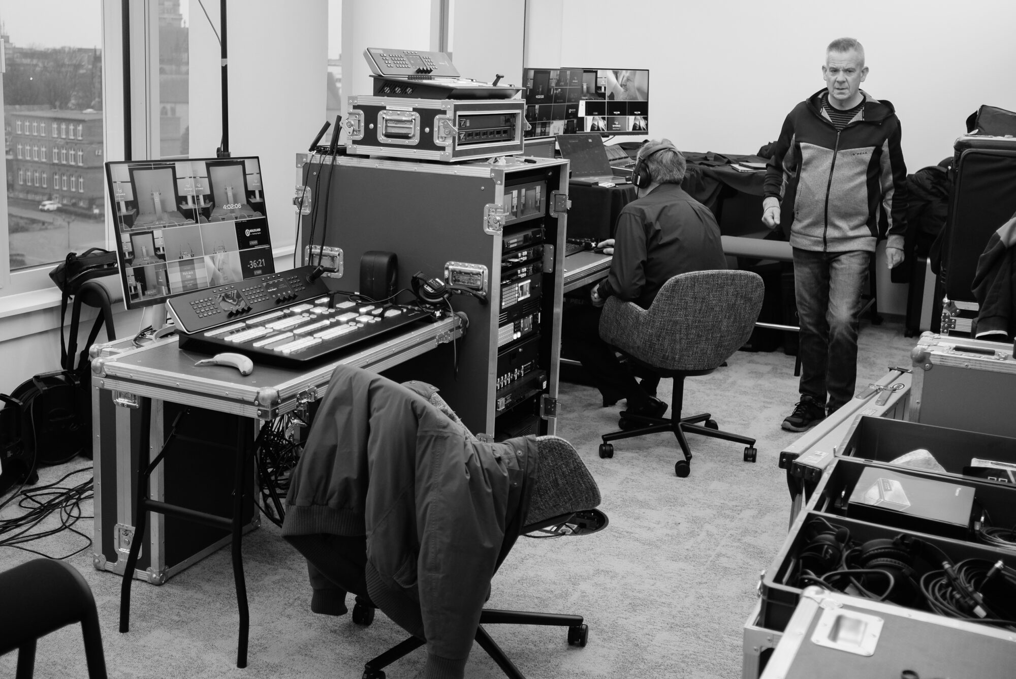 Video technician operating corporate event production equipment
