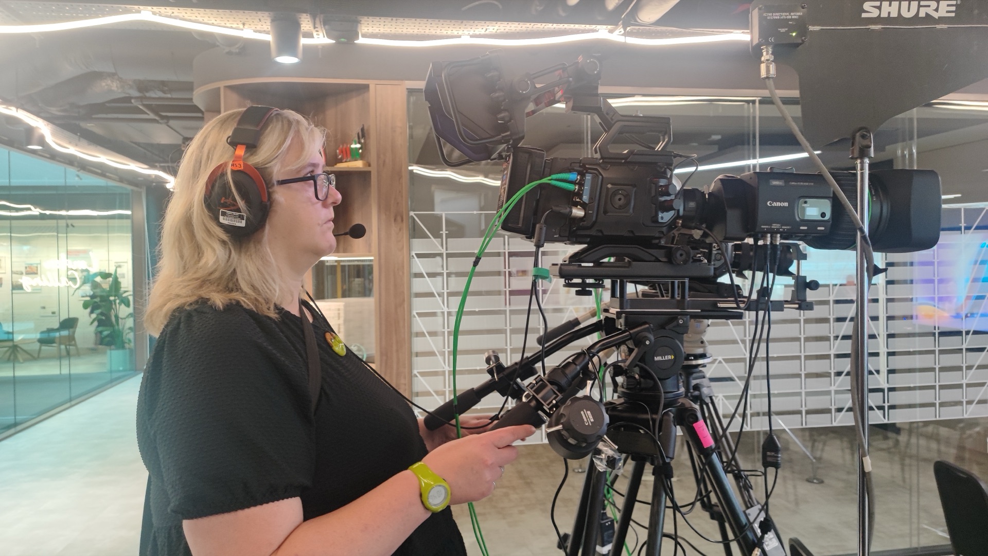 Camera operator working on the DP World EU Regional Townhall in the London office.