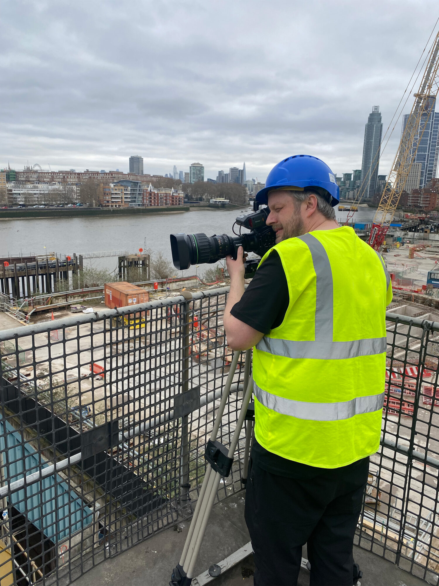 Camera operator filming beside the Thames during the Intelex and Cory customer-story production