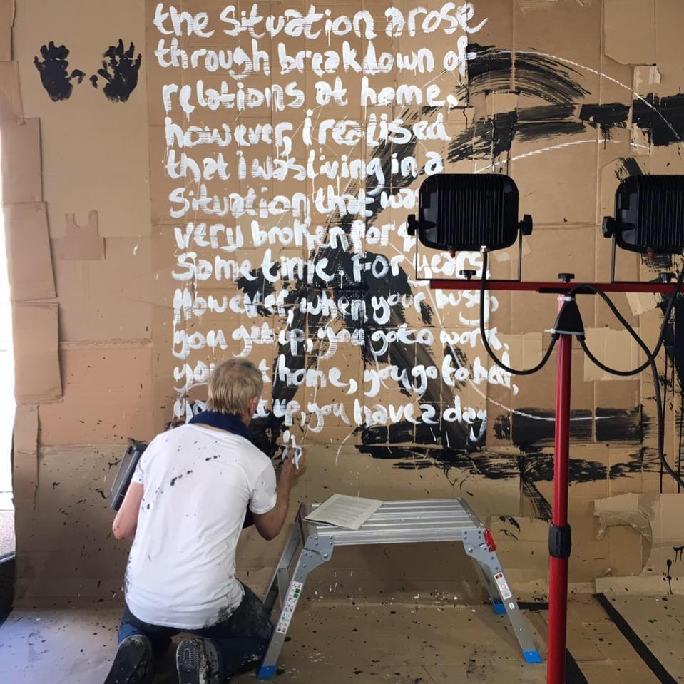 Karl Hyde painting words across the walls of UNFEAR for Manchester Street Poem at MIF17.