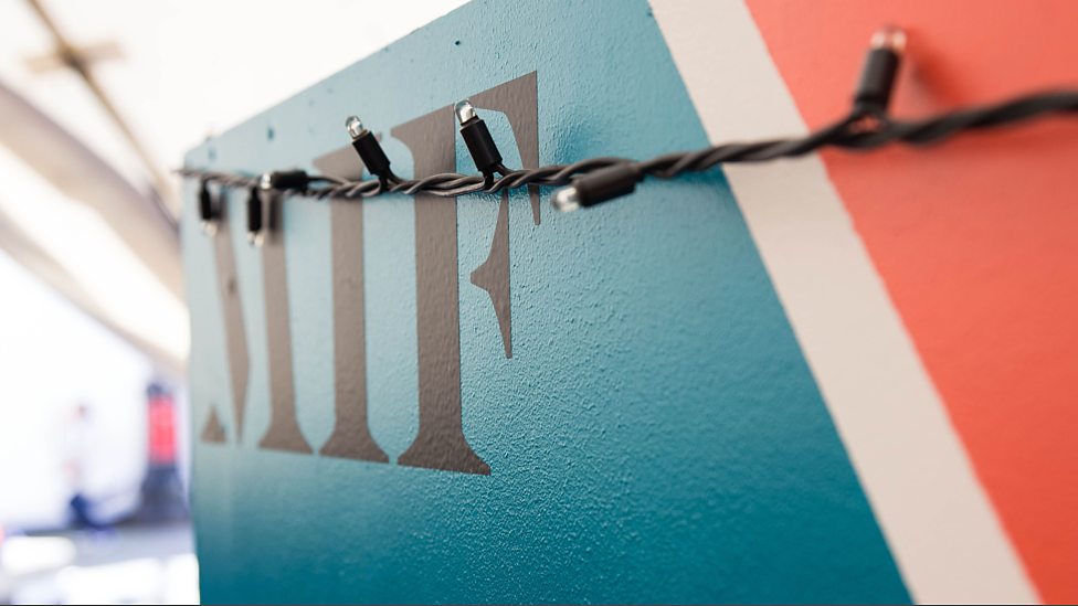Close-up of Manchester International Festival lettering and festoon lights during MIF17.