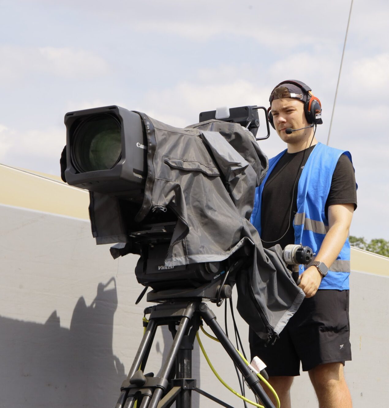 Broadcast camera operator filming Reggae Land 2026 for IMAG and live streaming